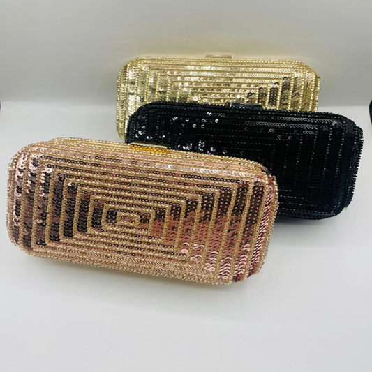 Three beaded clutch bags in gold, black, and rose gold on a white background