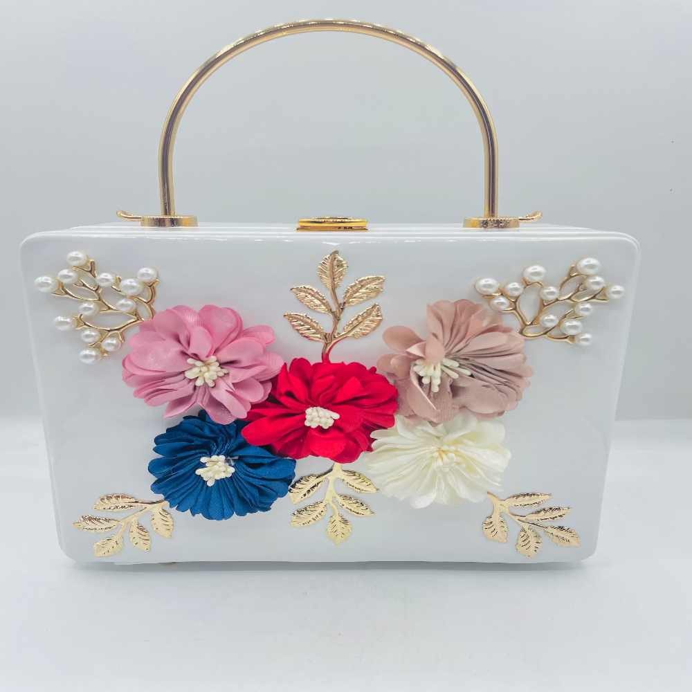 White handbag with floral decorations on a white background