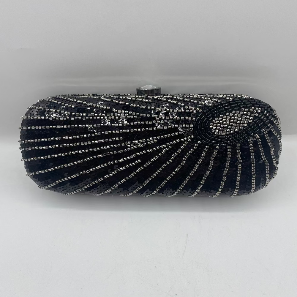 Black beaded clutch bag on a white background