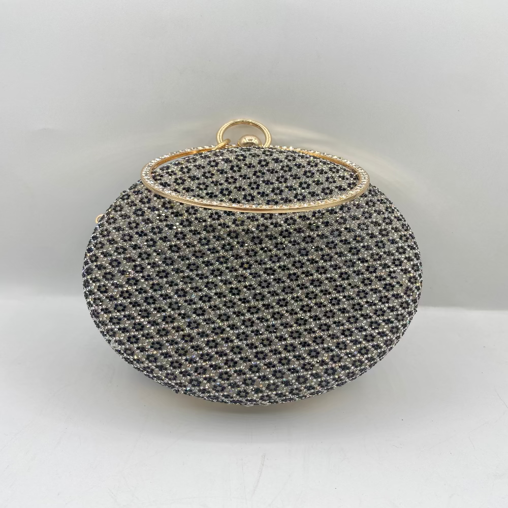 Round black beaded handbag with gold trim on a white background